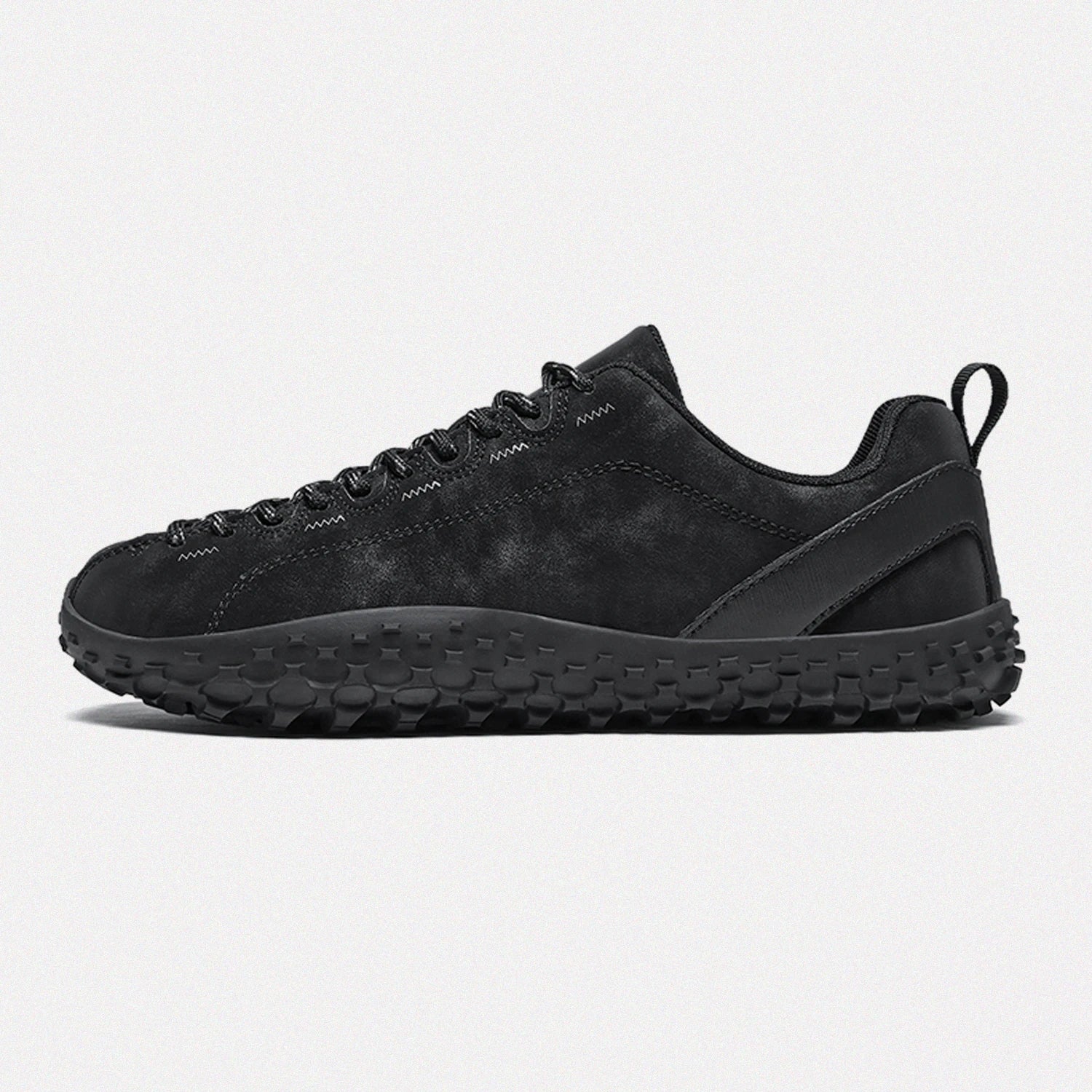 Dannto black barefoot outdoor sneakers shown from the side