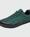 Dannto green barefoot trail shoes shown from a three quarter view