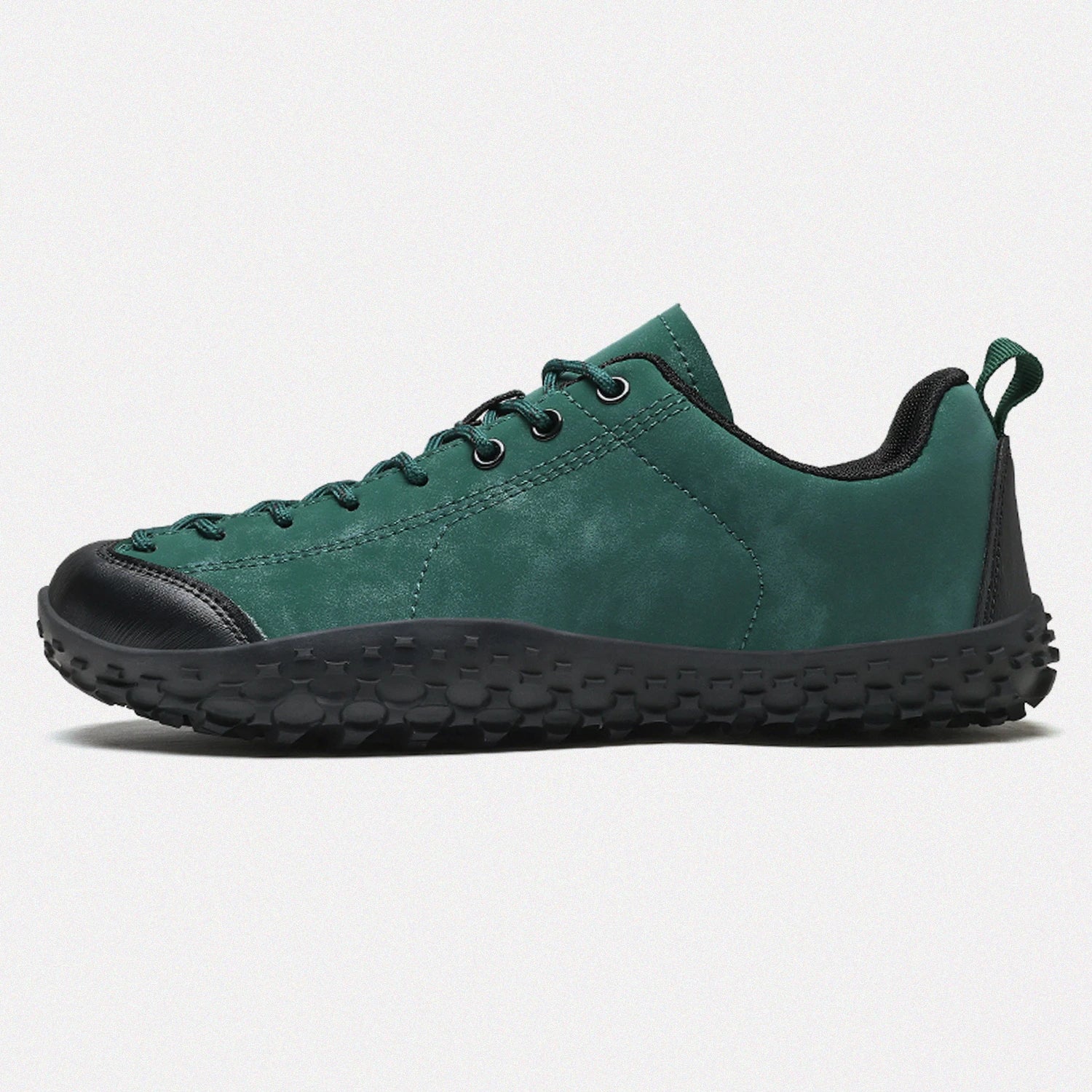 Dannto green barefoot trail shoes shown from the side
