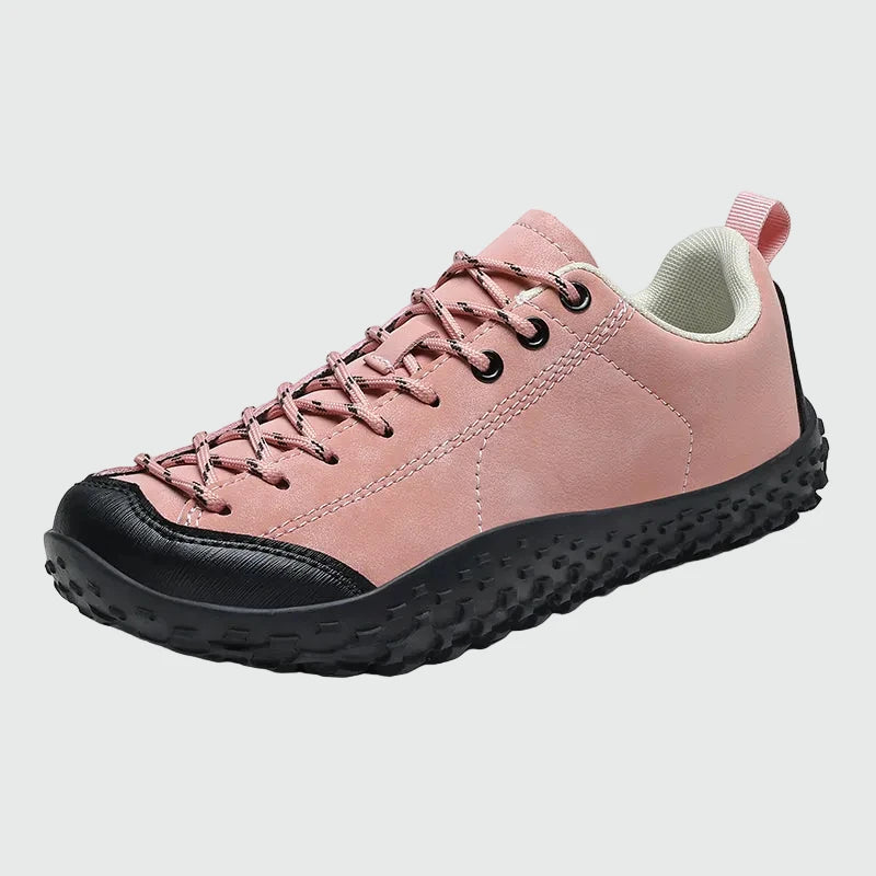 Dannto pink barefoot trail shoes shown from a three quarter view