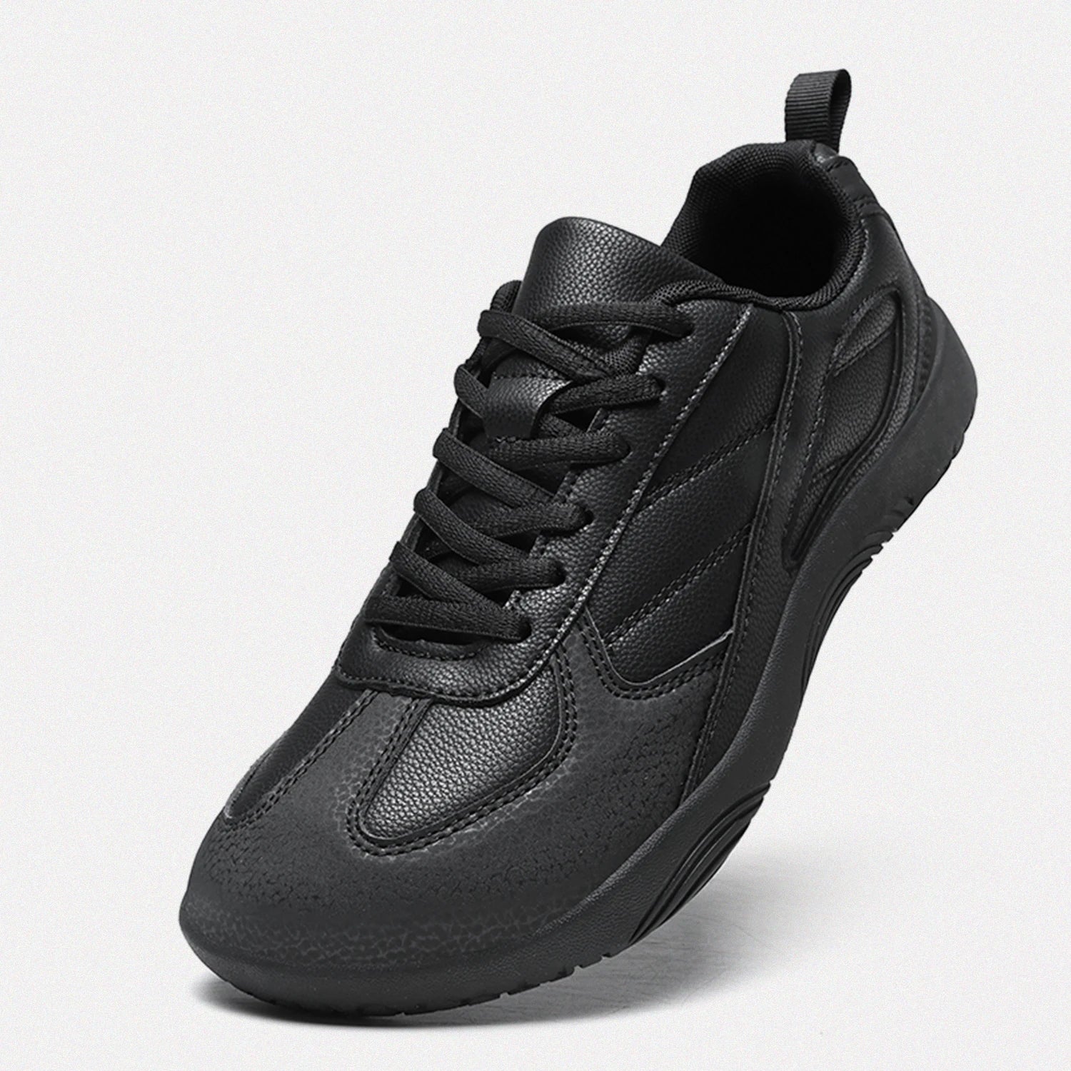 Dannto all black casual barefoot shoes shown from a three quarter view