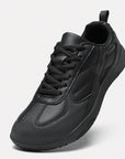Dannto all black casual barefoot shoes shown from a three quarter view