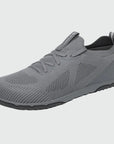Dannto dark gray zero drop barefoot sneakers shown from a three quarter view