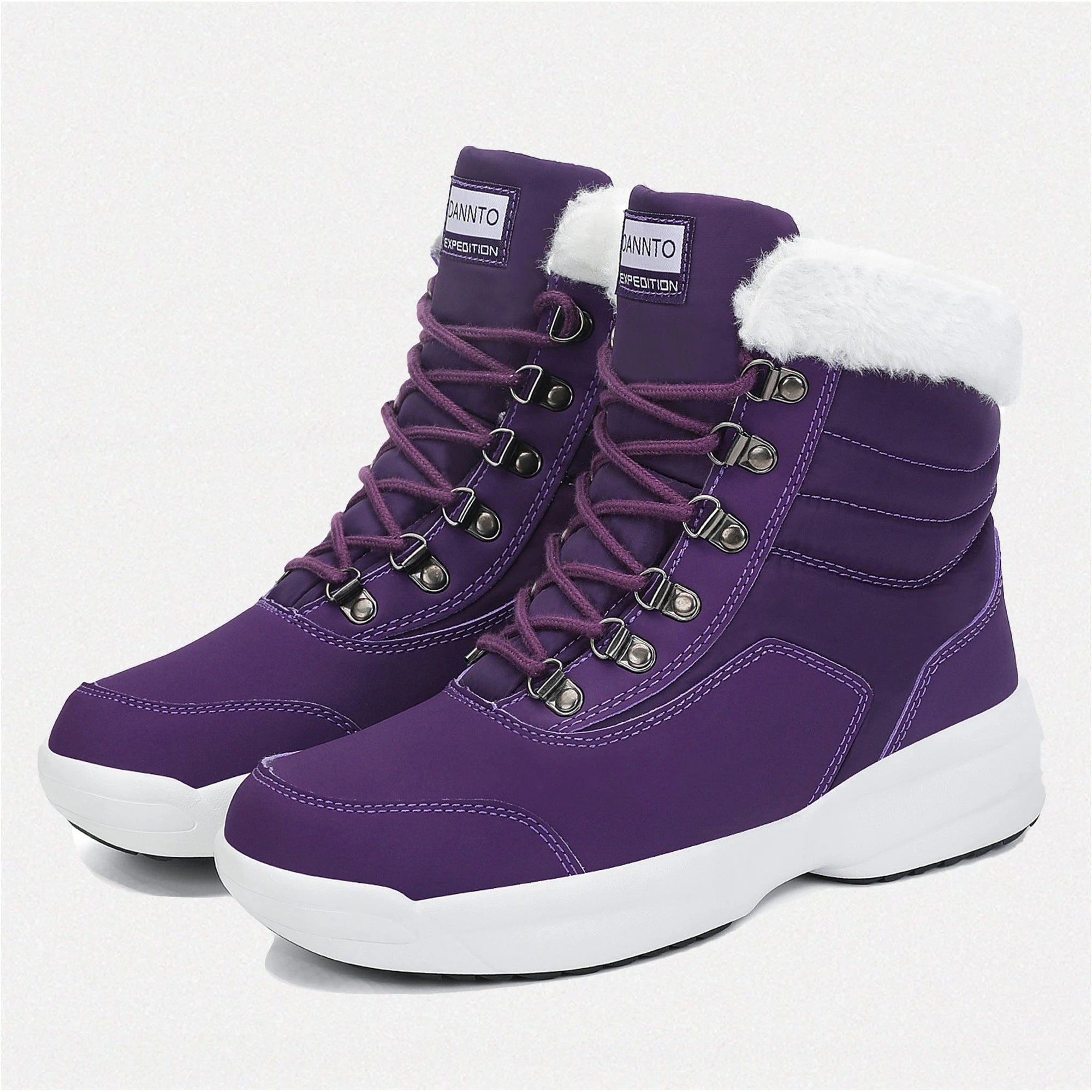 two Dannto women‘s purple winter snow Boots shown at a side angle